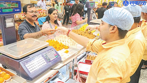 Customers buying modak on the occasion of Ganesh festival.