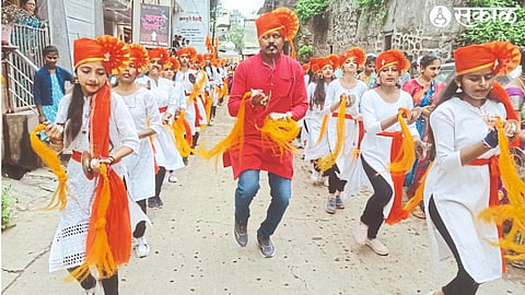Students of Muktananda Vidyalaya performing a procession and performing cymbals on the occasion of the arrival of Ladkya Bappa on Saturday.