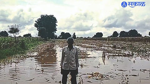 A farmer who is frustrated because of water logging in the field.