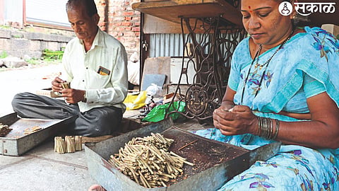 A couple preparing vidi after receiving raw material in Dubere village of Sinnar taluka