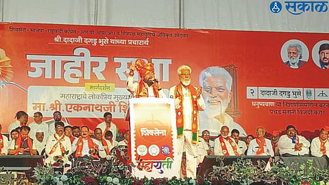 Chief Minister Eknath Shinde speaking at a public meeting. Dada Bhuse, the candidate of Mahayuti from neighboring Malegaon district.