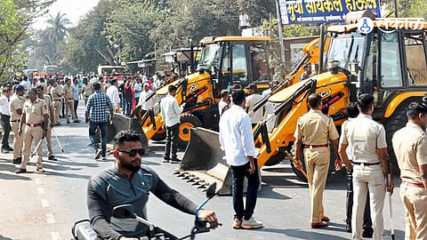 Shri Ramapur municipality demolishing illegal encroachments along Belapur Road as part of an ongoing anti-encroachment campaign.