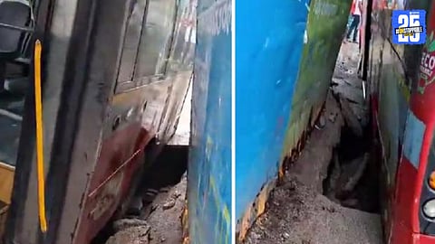 A BEST bus in Mumbai partially submerged in a 5-foot-deep pit after sudden road collapse; panic spread among passengers, no major injuries reported.

