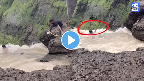 viral video tourist stuck in rising water at waterfall saved by locals