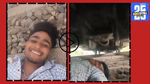 A still from the viral video showing a young man lying on a railway track as a high-speed train passes over him, leaving viewers stunned.


