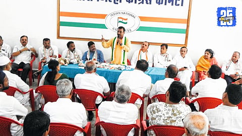 “Congress National Secretary B.M. Sandeep addressing party workers at Satara Congress Bhavan; sharp criticism directed at RSS.”
