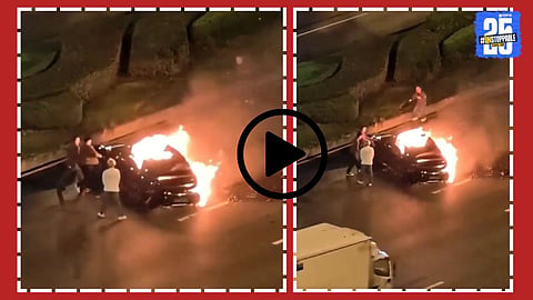 Flames engulf the Xiaomi SU7 electric car after it caught fire in the middle of the road, leaving the driver trapped inside due to locked doors.