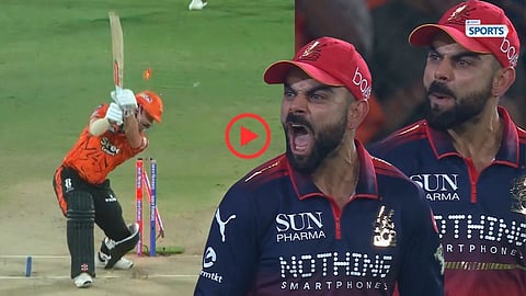 Virat Kohli celebrates passionately after Rasikh Dar bowled Travis Head
