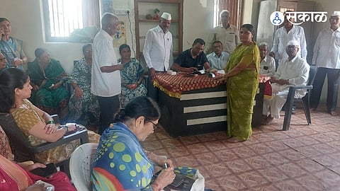 Senior citizens receive ST bus travel concession smart cards at Loni Kalbhor camp