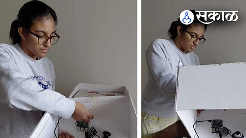 17-year-old Mahi Malhani from Delhi proudly showcasing her award-winning AI robot 'TrashBot' that autonomously collects and segregates waste with high accuracy.