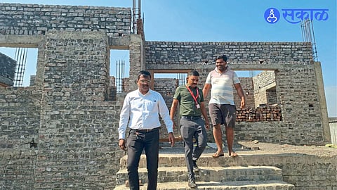 Block Development Officer Sachin Khude inspecting incomplete houses.