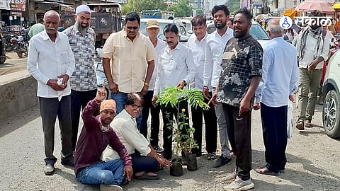 NCP workers staged a symbolic tree plantation protest over potholes on the Sakri Shirdi National Highway, demanding immediate road repairs.