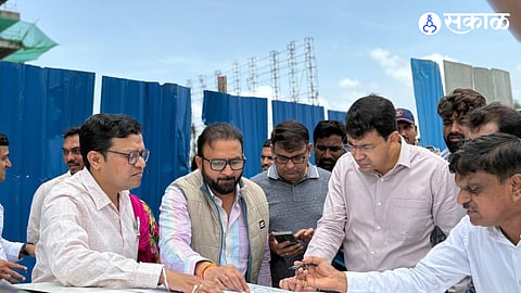 MLA Dnyaneshwar Katke discusses local infrastructure issues with PMRDA Commissioner Abhijit Chaudhari.