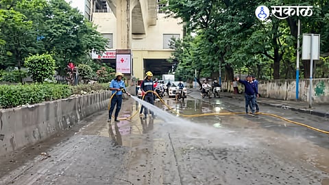 Fire brigade washes mud-covered Pune road after multiple two-wheeler accidents.