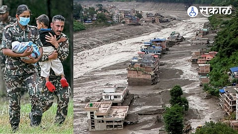 Nepalese soldiers brought an infant and another child who had survived the floods, to the Trishuli camp