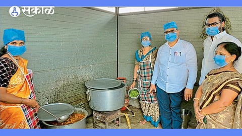 School Management Committee office-bearers and the headmaster inspecting the nutritious meal at a primary school manchar
