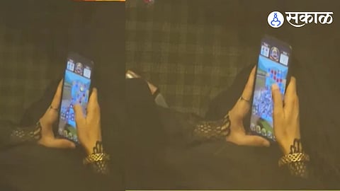 Corporator Playing Mobile Game In Municipal meeting