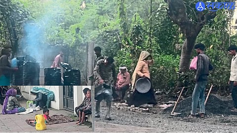 A migrant woman works on a road construction site in Nagpur while keeping her child nearby.