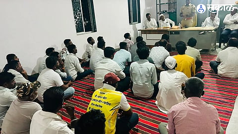 Manchar Police Inspector Mahadev Waghmode guides villagers during a security meeting at Valti in Ambegaon taluka.