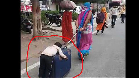 lockdown migrant labour mother pulling his child trolly bag viral video