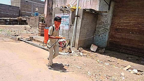 पिंपळगाव रेणुकाई (जि.जालना)  :  गावात औषधी फवारणी करताना.