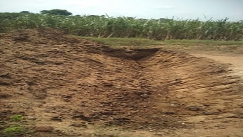 drains are dig on road to stop theft of sand 
