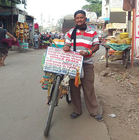 Nagraj Gowda preaching the message of world peace on a bicycle