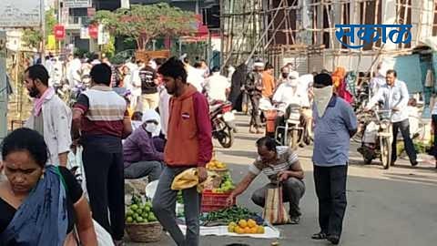 The villagers are not observing social distance in the weekly market at Rajur.jpg