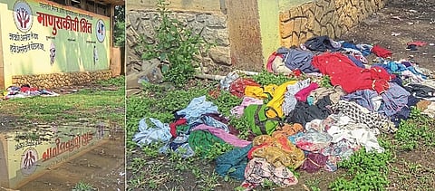 Heaps of clothes in the mud: a roof over the wall of humanity; The corona of the municipal enterprise is windy