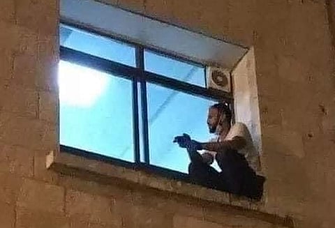 He was sitting at the window looking at his mother for the last time
