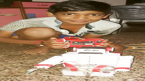 during lockdown period 7th standard boy prepare a robot who spray sanitizer
