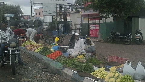 vegetable market  fills on footpath at Chinchwade Nagar