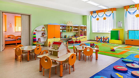 teachers in school decorated walls of classrooms for students 
