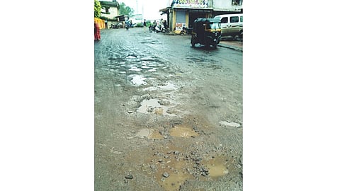 pothole in the road at peth village
