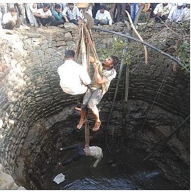 tractor fell in to the well