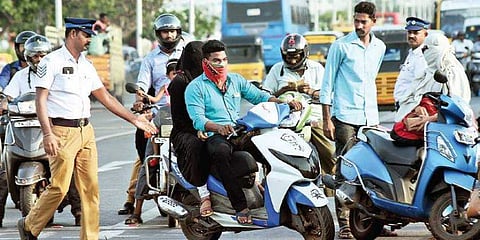 Two-wheelers are prohibited from cycling to maintain social distance during the period of curfew 