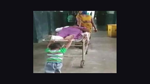 four year old boy pushing stretcher at hospital at up video viral