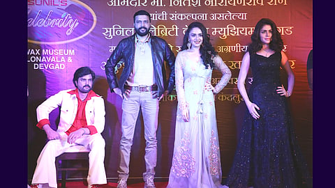 Vax statue of Ankush chaudhary Amruta Khanvilkar esakal news