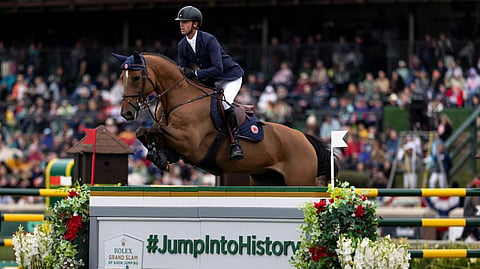 Rolex Grand Slam voittajat Ben Maher ja selle francais Enjeu de Grisien. 


