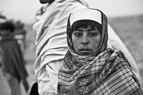 At a crossroads: a young Afghan waits at a checkpoint in Nazyan district, Nangarhar province. 
Credit: U S Army
