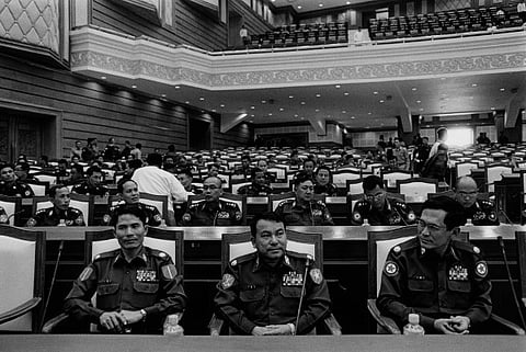 The unelected in Burma’s new parliament. Military commanders take their positions in the new parliament building. The Pyithu Hluttaw, or lower house of Burma’s parliament, is dominated by former soldiers, their positions guaranteed under a constitution which was ratified after a fraudulent referendum in 2008. 
Photo: Nic Dunlop