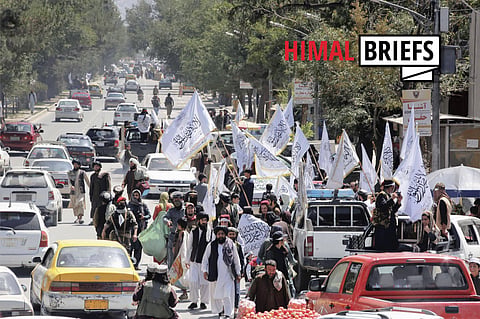 Marking one year since US withdrawal from Afghanistan, Taliban flags are flown on the streets of Kabul. August 2022. Photo: IMAGO / Kyodo News.