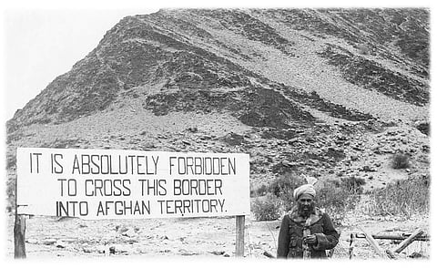 A guard at the Afghan territory border with British India, circa 1930. The events of the Third Anglo-Afghan War are inscribed not just in the border but also in the relationship between the colonial photographer and the photographed. Photo courtesy: Unknown publisher / Omar Khan, PaperJewels.org 