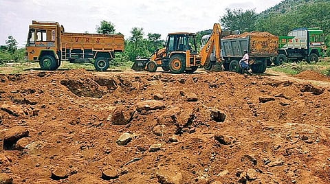 பொன்னேரி வனப்பகுதியில் அனுமதியின்றி மண் அள்ளப்பட்ட பகுதி.