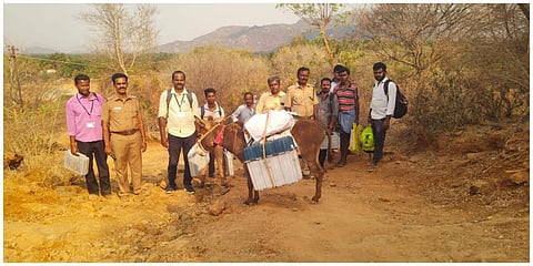 தேன்கனிக்கோட்டை அருகே உள்ள மலைகிராமத்துக்கு கழுதை மீது மின்னணு வாக்குப்பதிவு இயந்திரங்கள் கொண்டு செல்லப்பட்டன.
