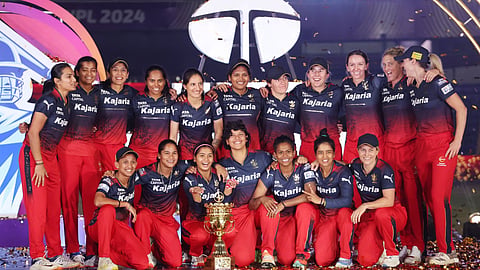 The RCB Womens team with the WPL Trophy 2024
