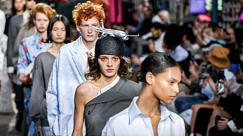 In frame: Models wear creations as part of the Moschino Spring Summer 2025 collection