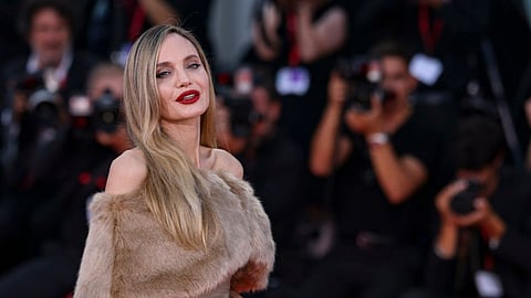 Angelina Jolie poses for photographers upon arrival for the premiere of Maria