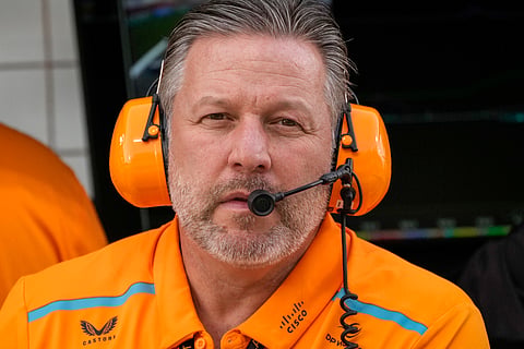FILE - McLaren chief Zak Brown looks at the garages during a Formula One preseason test at the Bahrain International Circuit in Sakhir, Bahrain, Feb. 23, 2024