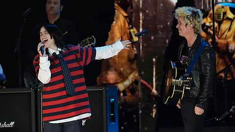 Billie Eilish, left, performs with Billie Joe Armstrong of Green Day during the FireAid benefit concert 